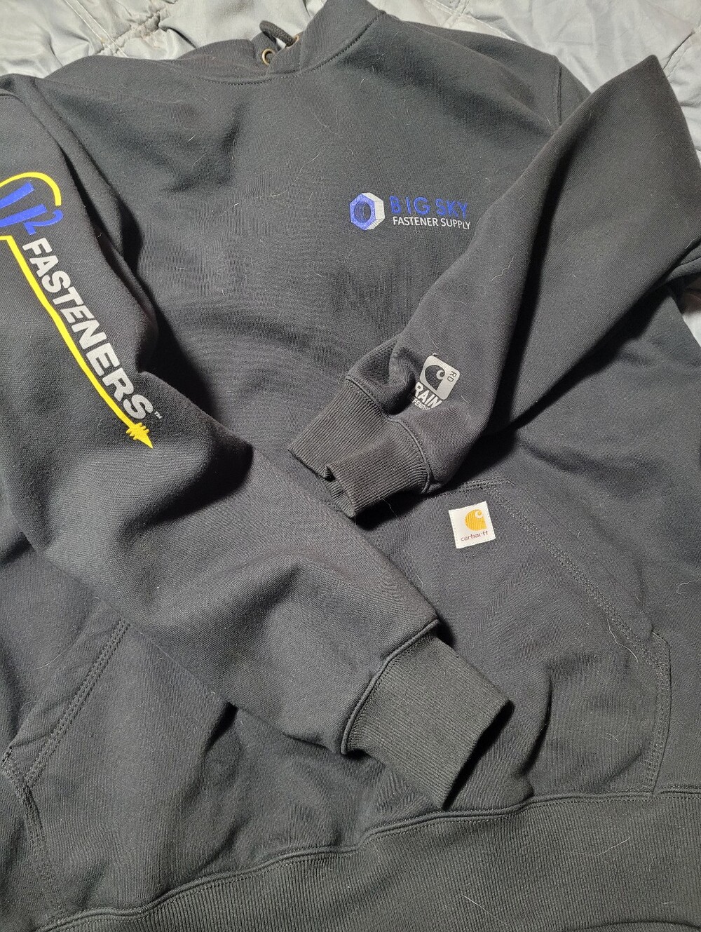 Carhartt Black Hoodie with Big Sky Fastener Supply Logo and Yellow Sleeve Print